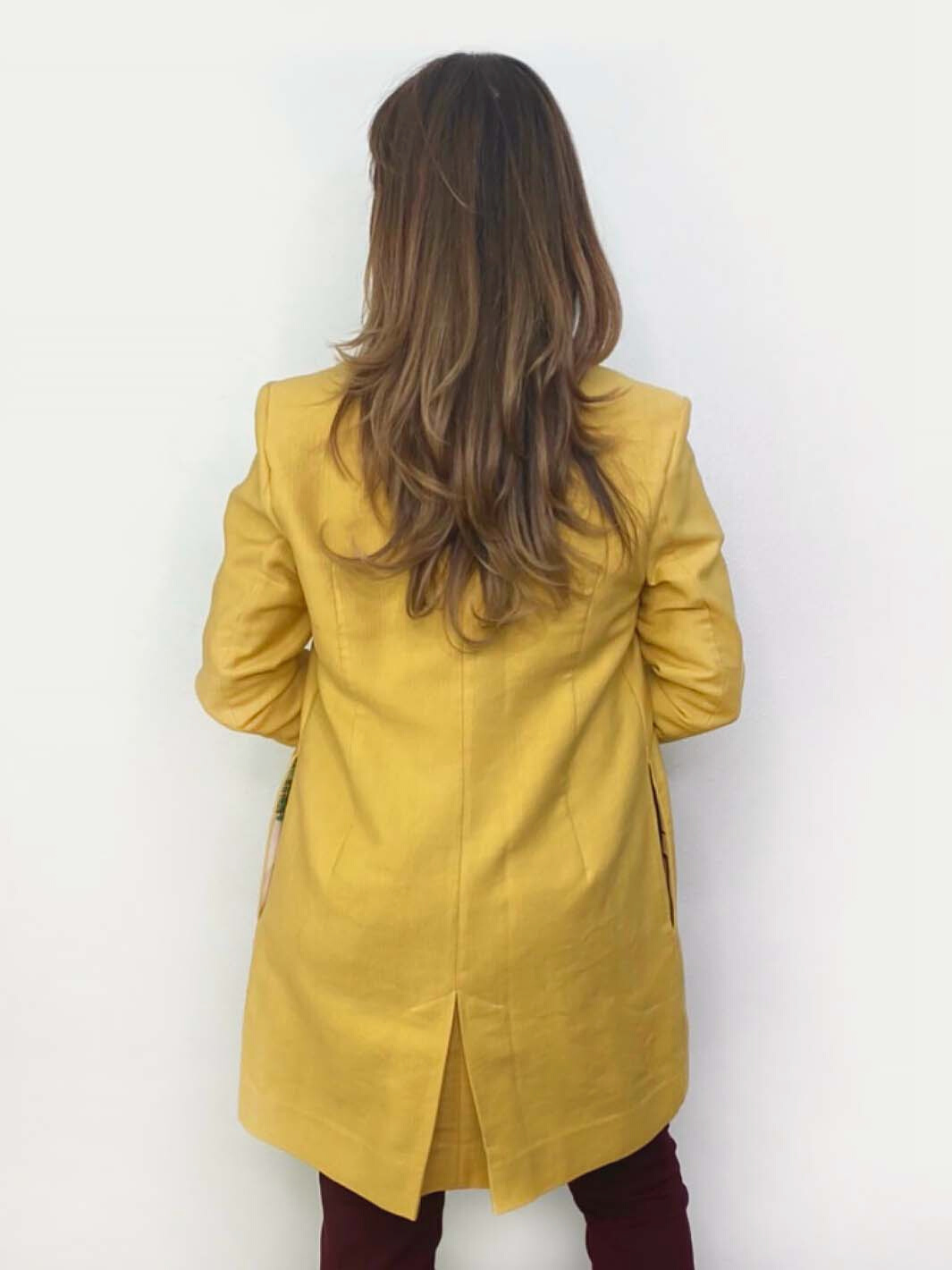 Petite coat with two-piece sleeve, hem just above the knee and a pleat at center back hem for better movement